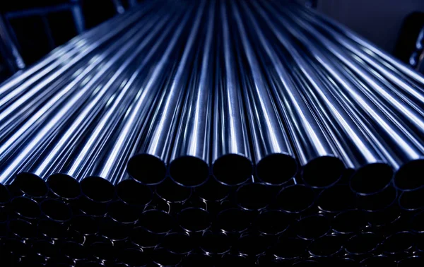 Abstract background of steel pipes stacked on a pallet — Stock Photo, Image