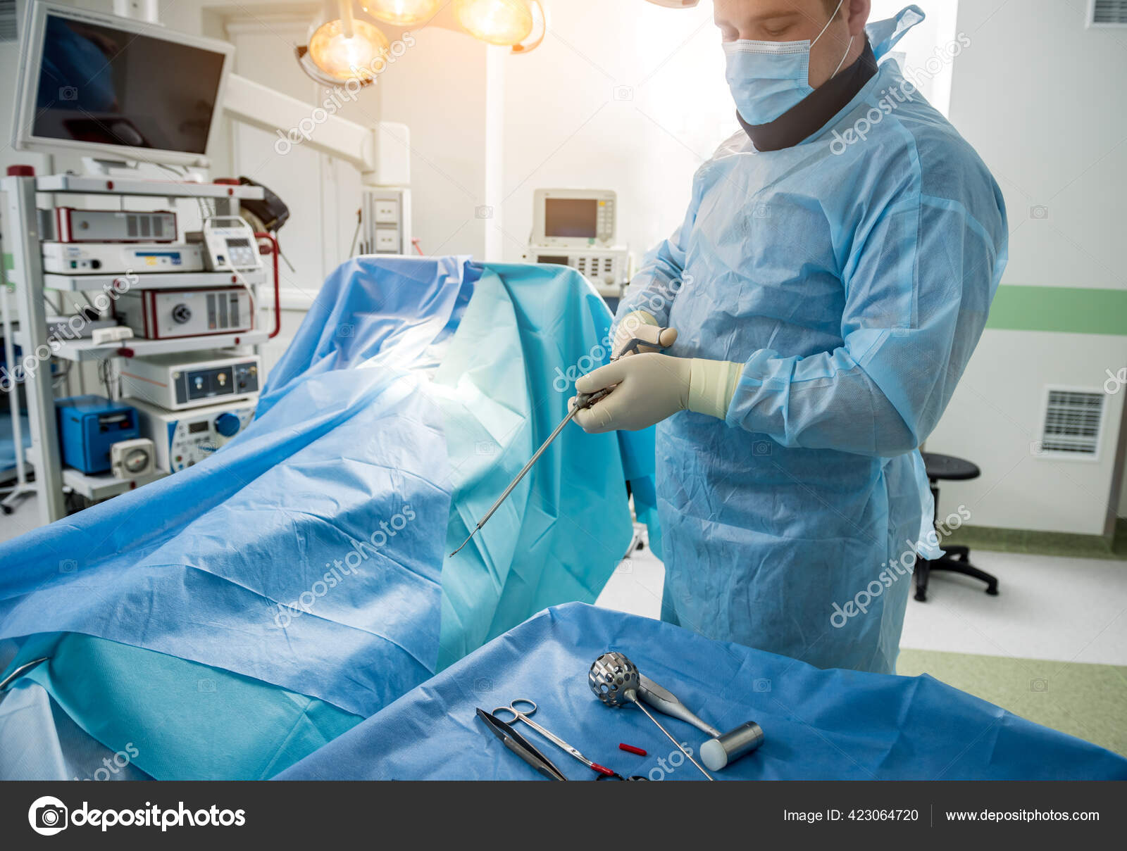 Surgeon performs endoscopic microdiscectomy of herniated intervertebral