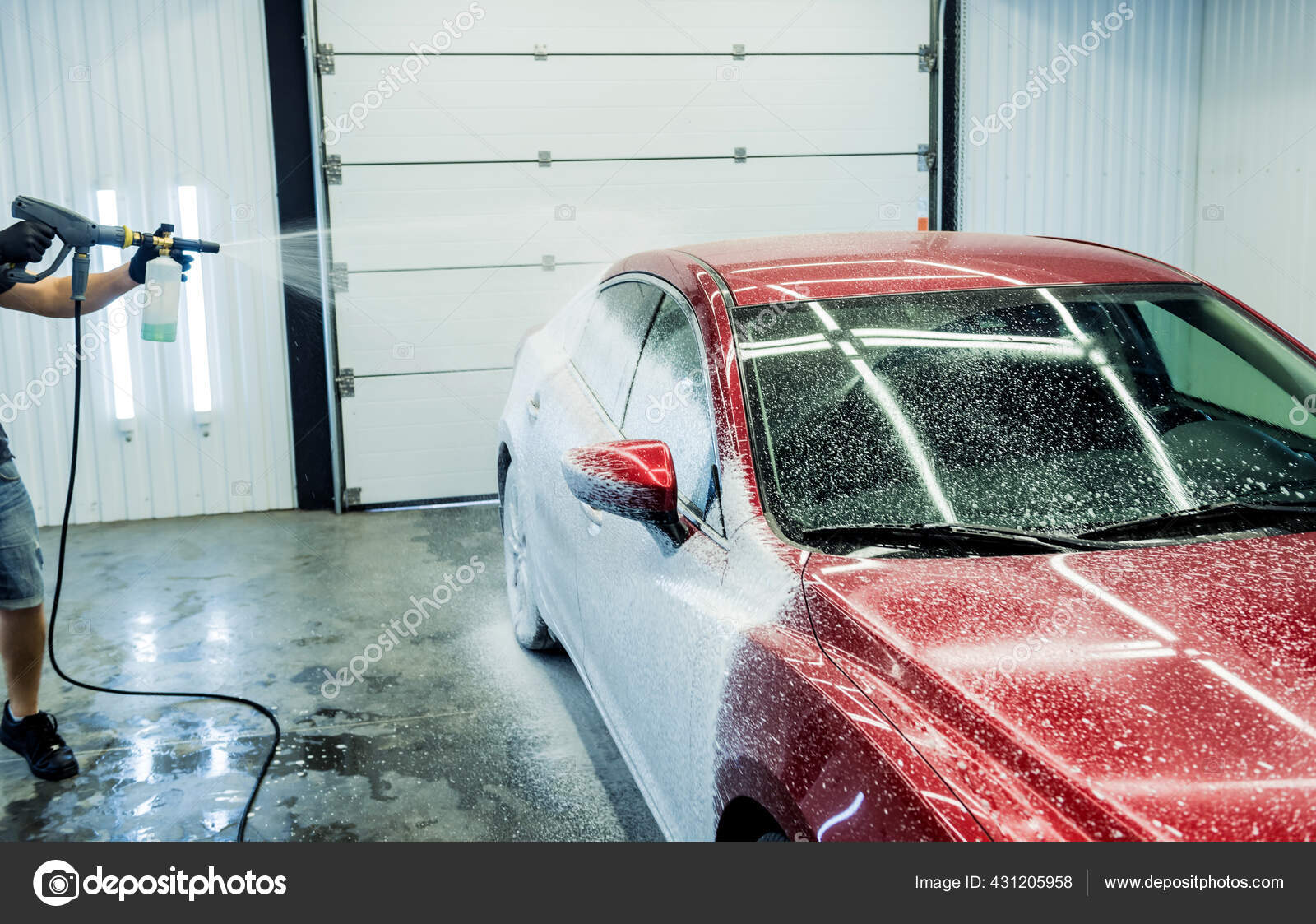 Outdoor Car wash worker Cleaning stains with foam soap. Leave space to  write a description of the message. Stock Photo