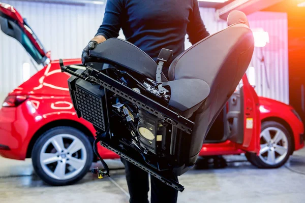 Car service worker disassemble the interior of the car — Stock Photo, Image