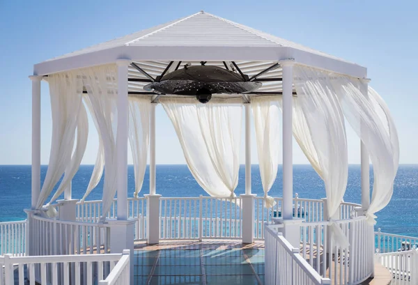 Romantic gazebo on the beach with blue sea — Stock Photo, Image