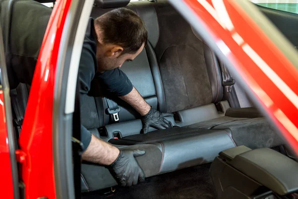 Car service worker disassemble the interior of the car — Stock Photo, Image
