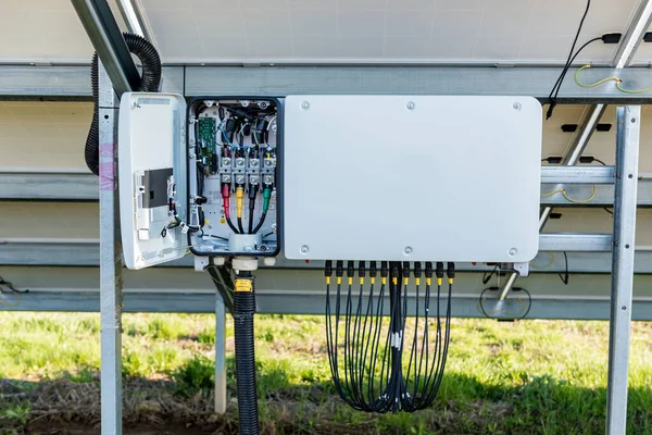 Opened voltage inverter at the back side of solar panel — Stock Photo, Image