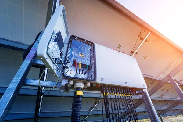 Opened voltage inverter at the back side of solar panel — Stock Photo, Image