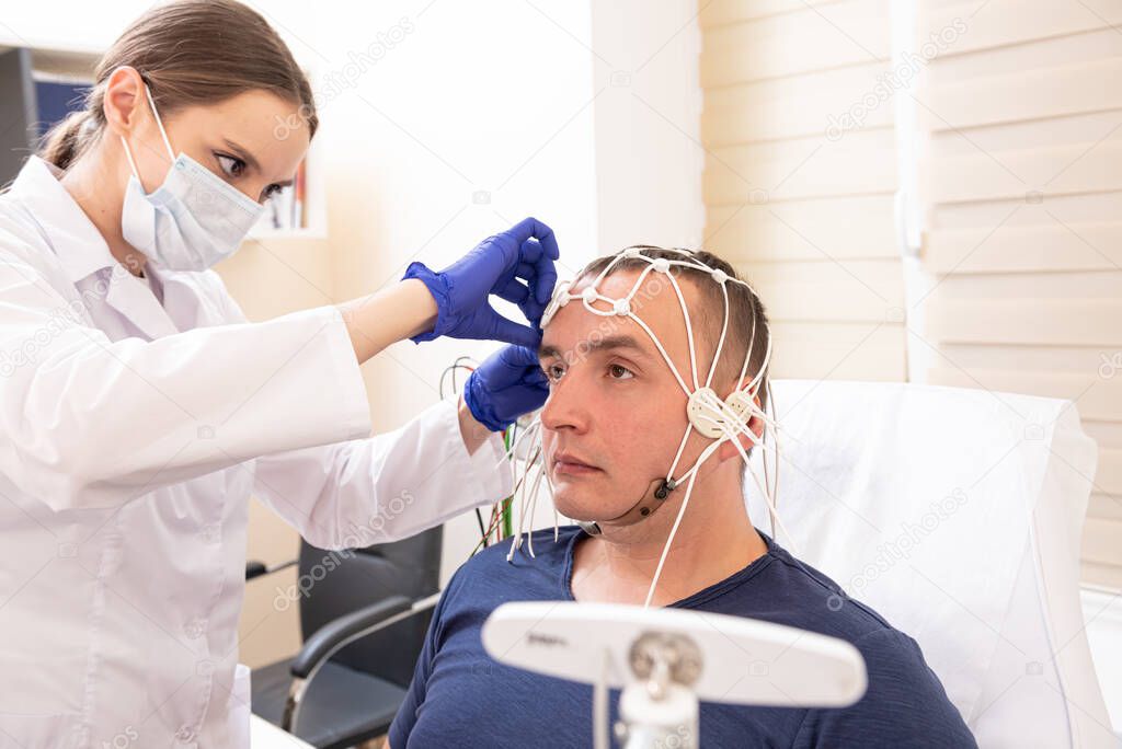 Patient brain testing using encephalography at medical center