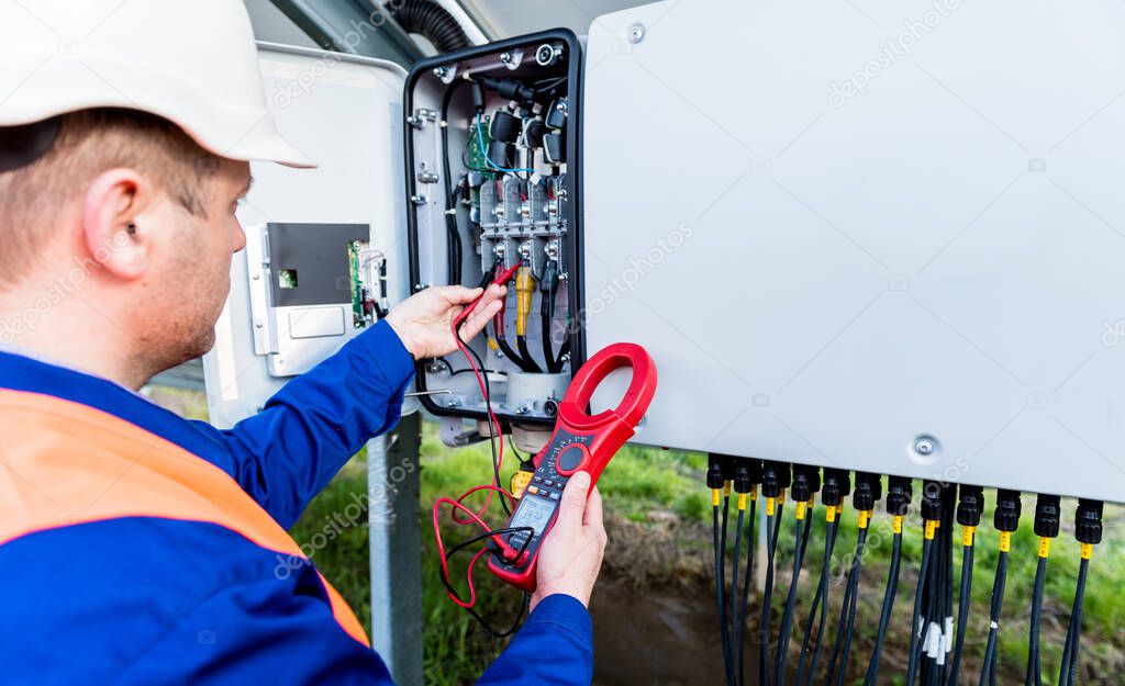 The inspector checks the actual output voltage level of inverter