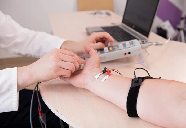 Patient nerves testing using electromyography at medical center