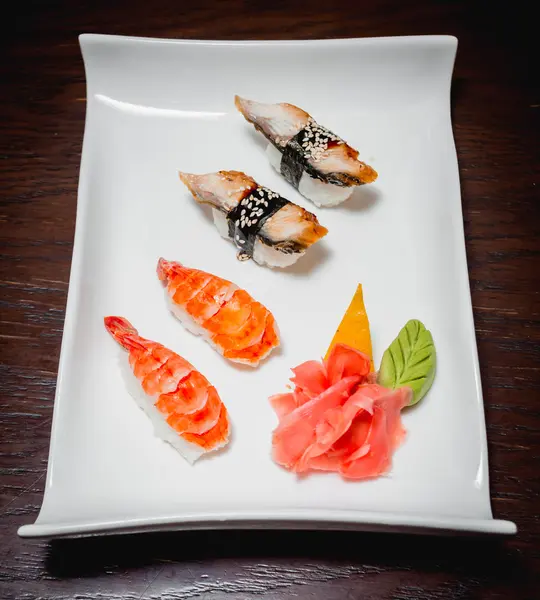 Sushi on white plate — Stock Photo, Image