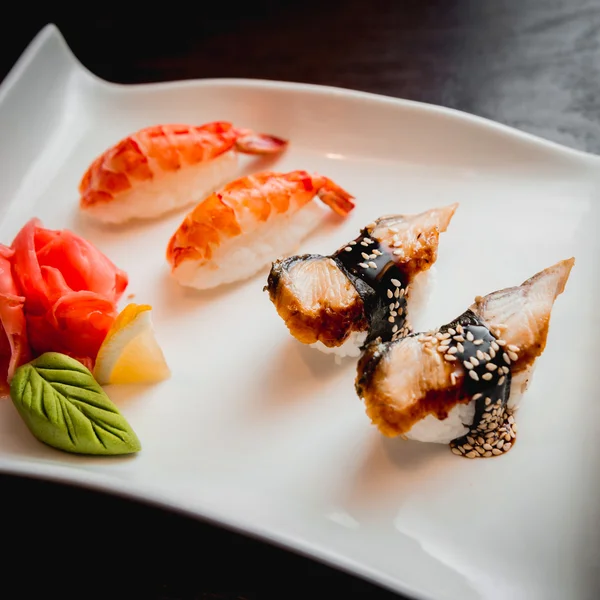 Sushi on white plate — Stock Photo, Image