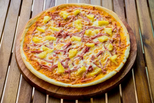 Large pizza with meat and cheese