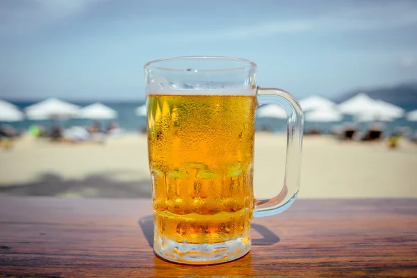 Mug of cold beer with foam Royalty Free Stock Photos