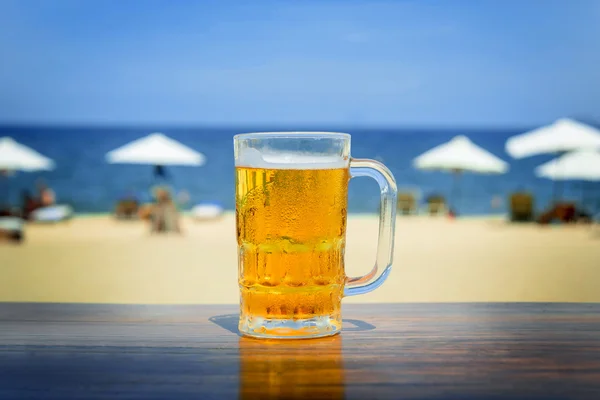 Mug of cold beer with foam Stock Photo