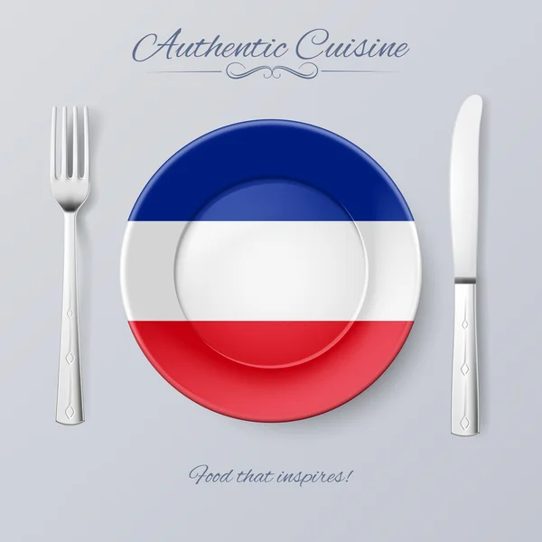 Аутентичная кухня Югославии. Тарелка с югославским флагом и столовыми приборами — стоковый вектор
