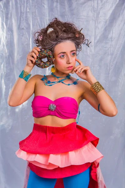 Beautiful  girl with colorful donut and muffin — Stock Photo, Image