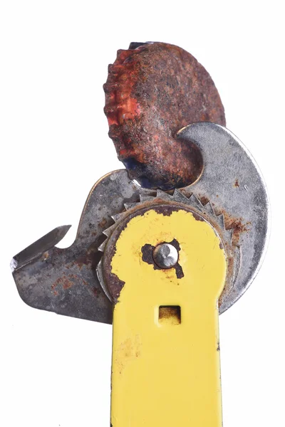 Old rusty can bottle with can opener tool — Stockfoto