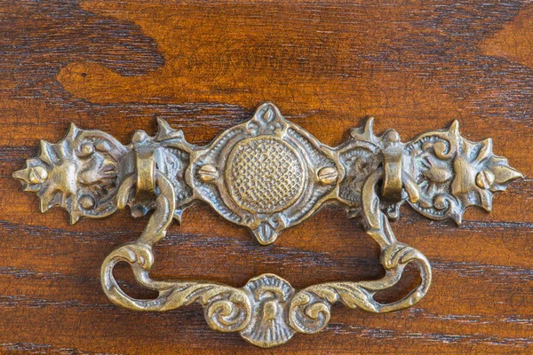 Antique drawer pull handle close-up