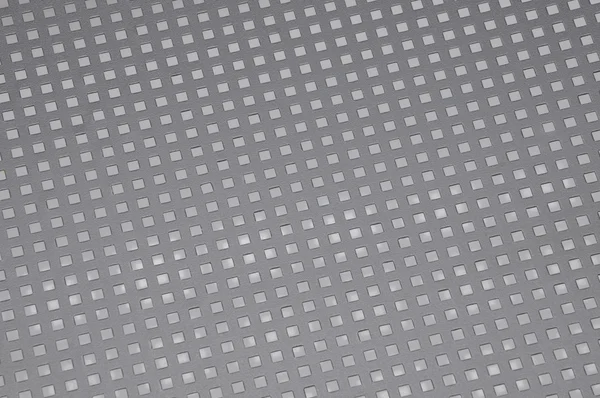 Oberfläche Metall mit quadratischen Löchern — Stockfoto