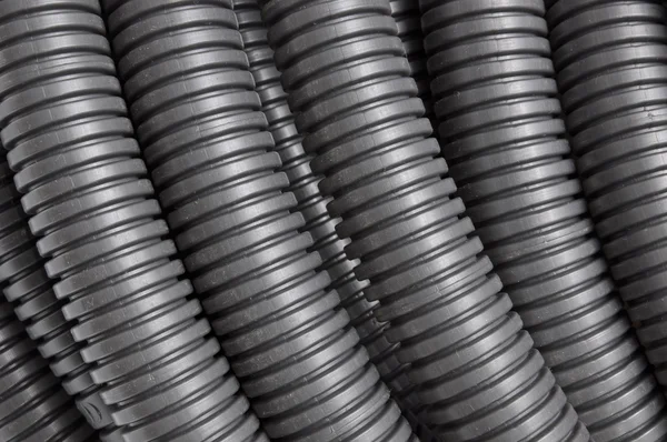 Black corrugated pipes — Stock Photo, Image