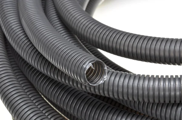 Black corrugated pipes — Stock Photo, Image