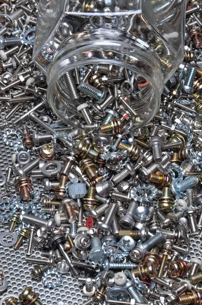 Set of bolts screws and nuts with the jar — Stock Photo, Image