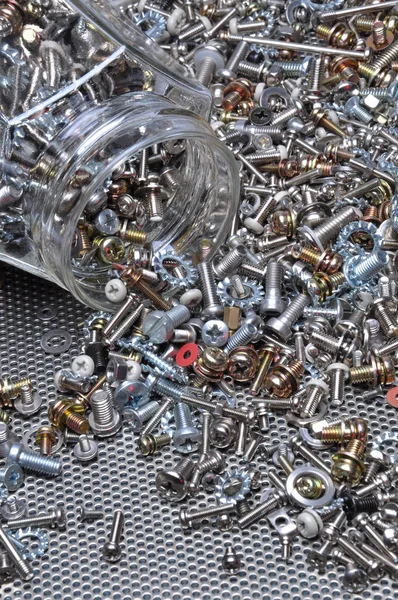 Set of bolts screws and nuts with the jar — Stock Photo, Image