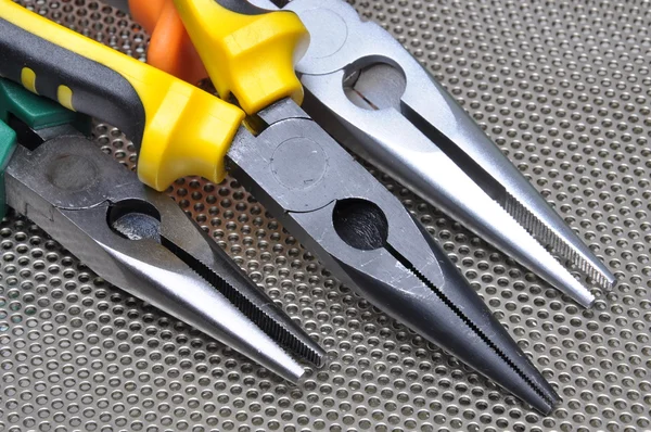 Pliers tools for electrician on metal surface — Stock Photo, Image
