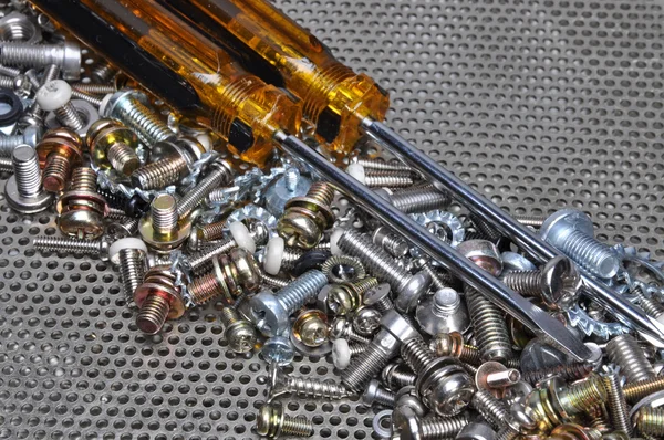 Screwdrivers and components bolts, nuts, washers, screws — Stock Photo, Image