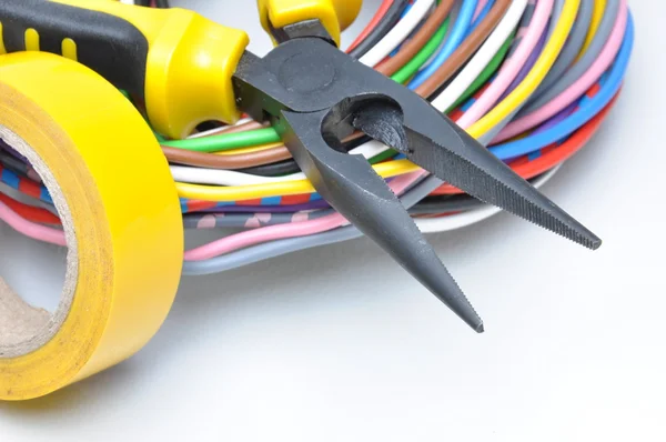 Electrical tools and cables on metal surface — Stock Photo, Image