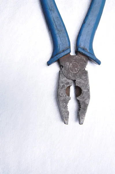 Old pliers on grey metal background with place on text — Stock Photo, Image