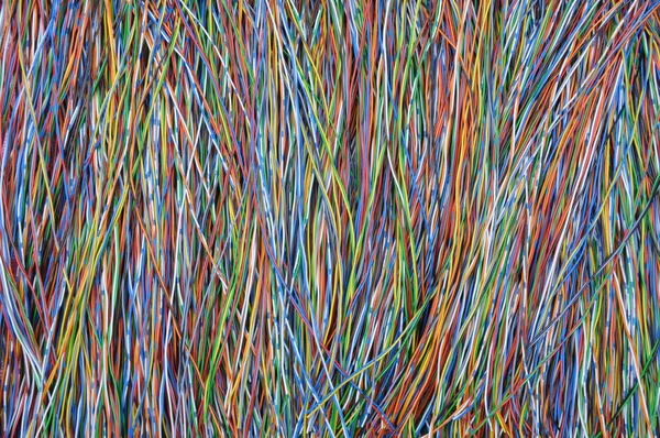 Colored wires in global telecommunications networks — Stock Photo, Image
