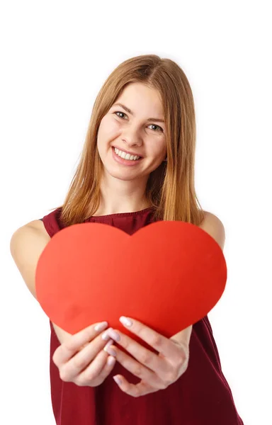 Girl Holding a Big Red Heart. Royalty Free Stock Images