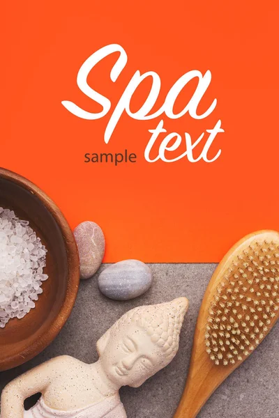 Spa Kosmetika Stenar Massage Borste Buddha Statyett Orange Bakgrund Med — Stockfoto