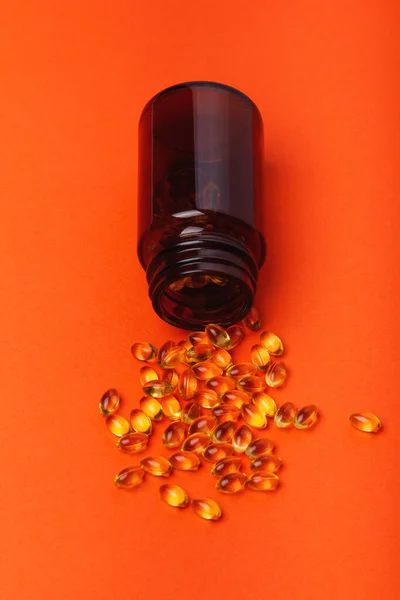 Clean Photo Vitamin Bottle Spilled Contents Orange Backgound — Stock Photo, Image