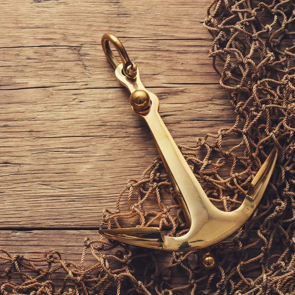 Anchor on wood background — Stock Photo, Image