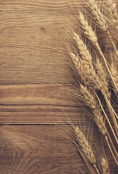 Wheat on the wooden background — Stock Photo, Image