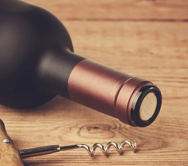 Bottle of wine with corkscrew — Stock Photo, Image