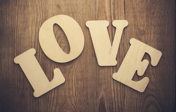 Word LOVE on wooden background — Stock Photo, Image