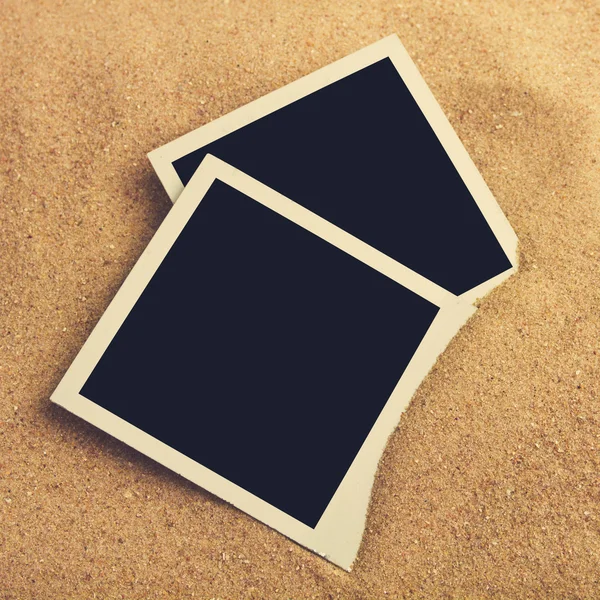 Photo frames on sand — Stock Photo, Image