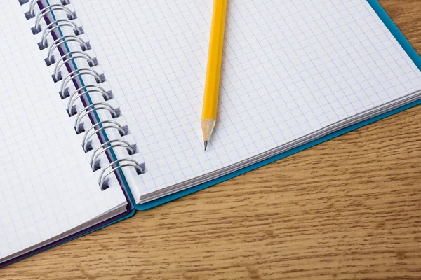 Close up of notebook with pencil — Stock Photo, Image