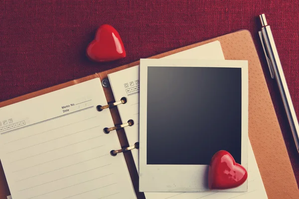 Photo and hearts on Notebook — Stock Photo, Image