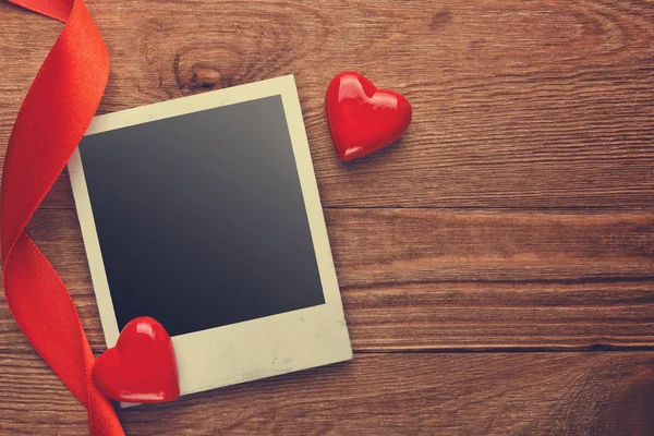 Blank instant photo and hearts — Stock Photo, Image