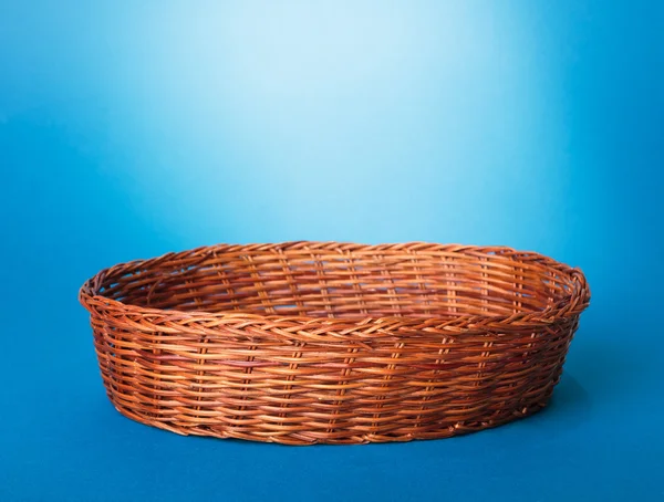 Basket on blue background — Stock Photo, Image