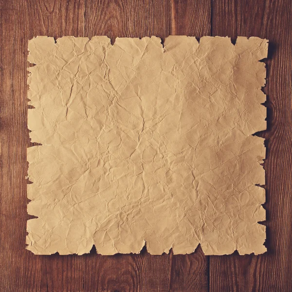 Old paper on wood — Stock Photo, Image