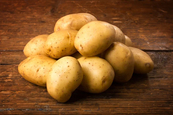 Alimentos de batatas no fundo — Fotografia de Stock