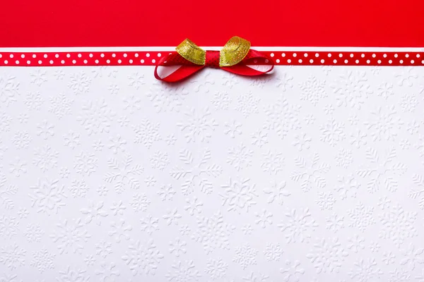 Card with red ribbon bow — Stock Photo, Image