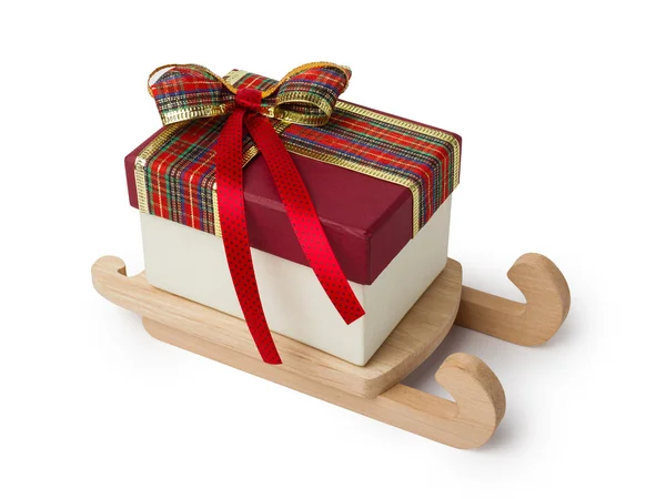 Gift in sleigh on white — Stock Photo, Image