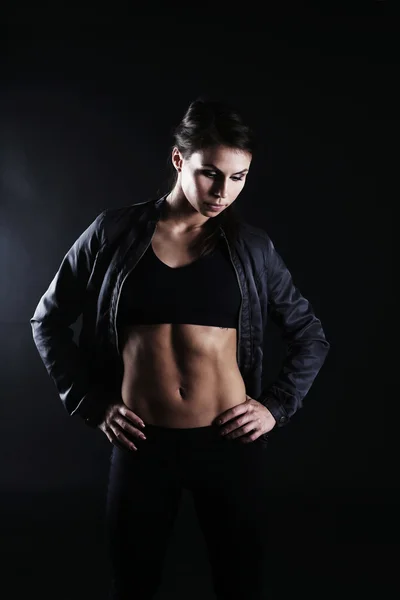 Fit woman in short top and jacket — Stock Photo, Image