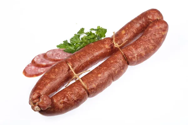 Wurst Und Scheiben Mit Grün Auf Isoliertem Studiohintergrund — Stockfoto