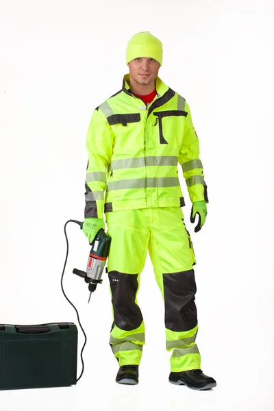 Hombre en uniforme con el taladro eléctrico —  Fotos de Stock