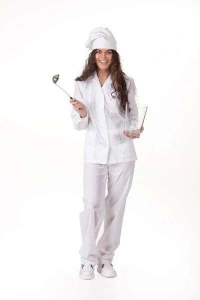 Mujer joven con el uniforme de cocinero —  Fotos de Stock